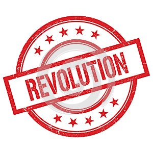 REVOLUTION text written on red vintage round stamp