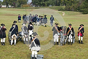Revolutionary War re-enactors re-create the cannon fire and subsequent cease-fire of the British army, in which they flew the whit