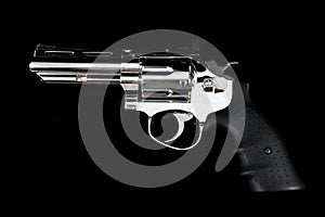 A Revolver Gun on a black background