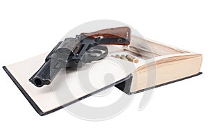 Revolver gun with cartridges hidden in a book