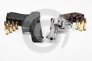 Revolver gun and Semi automatic handgun with bullets on white background