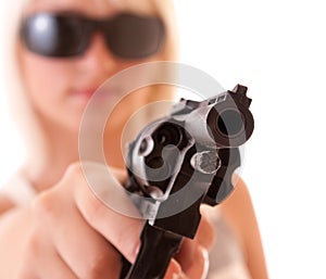 Revolver in hands of woman isolated