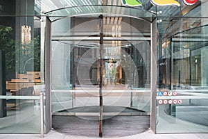 Revolving glass doors in office building