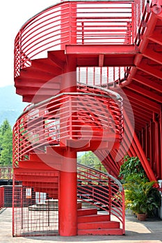 Revolving ladder with handrail in red photo