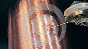 Revolving spool with newly-produced copper wire on it