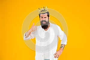 Reward concept. brutal guy prince yellow background. King of party. Egoist selfish man. Superstar concept. Royal status photo