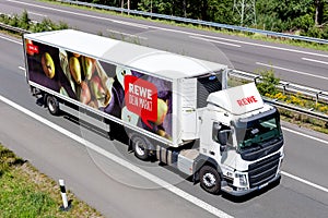 REWE truck on motorway.