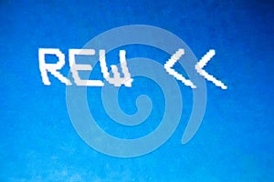 Rewind sign on the screen. Glitch