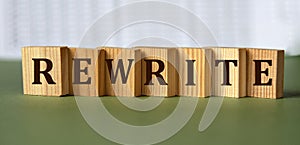 REWRITE - word on wooden blocks on light background