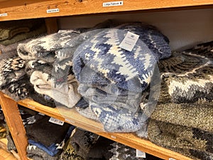 Traditional Icelandic sweater knitting Lopapeysa garmets for sale in a store