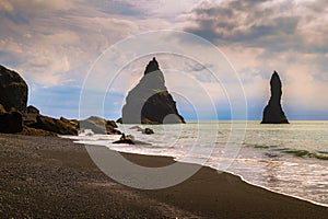 Reynisdrangar basalt sea stacks located near the township of Vik in Iceland