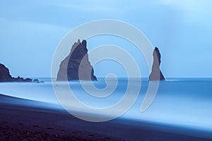 Reynisdrangar cliffs near village VÃÂ­k, South Iceland photo