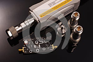 RF power sensor and microwave PCB isolated on black