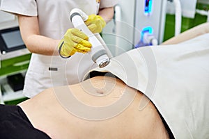 Rf skin tightening, belly. Hardware cosmetology. Ultrasound cavitation body contouring and sculpting treatment, anti-cellulite and