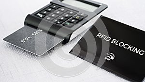 RFID protection sleeve for secure credit card from hacking, TAN generator with card on middle ground