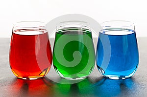 Rgb color water in glass on table
