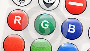 RGB Red Green blue buttons LED smart light remote control object detail, extreme closeup. Primary colors, basic colors lighting