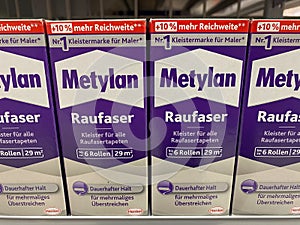Rheinbach, Germany  17 March 2021,  Several packages of Metylan woodchip wallpaper paste on the shelf of a hardware store