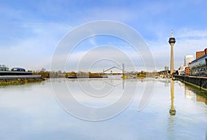 Rheinturm tower Dusseldorf with Reflection in Raine river photo