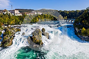 Rhine Falls, Rheinfall, Switzerland panoramic aerial view. Tourist boat in waterfall. Bridge and border between the cantons