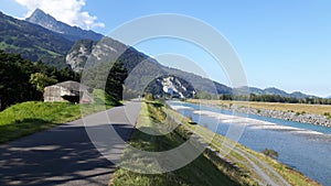 The rhine river and bicycle path with mountain and blue sky on the background