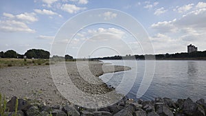 Rhine river in Cologne at low tide. dry stones at the shore