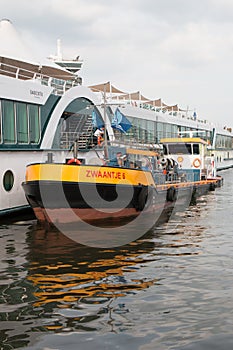 Rhine river cruise ship being refueled by a fuel boat