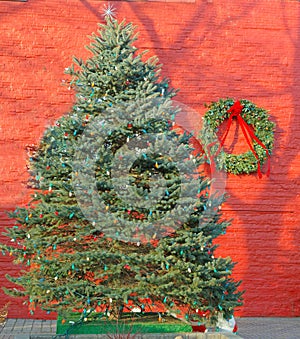 Rhinebeck New York Christmas or Winter holiday tree and green wreath with red bow