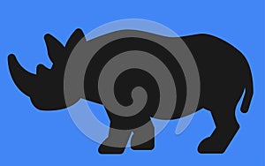 A Rhinoceros all black Silhouette shape against a blue backdrop