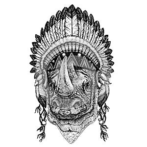 Rhinoceros, rhino, zoo. Wild animal wearing inidan headdress with feathers. Boho chic style illustration for tattoo