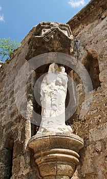 Rhodes, Church of Holy Trinity Agia Triada on Street of the Knights, statue on the wall. The Old Town of Rhodes, Greece