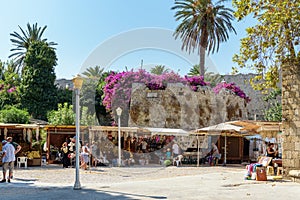 Small souvenir shops near old fortress walls at Rhodes town on Rhodes island, Greece