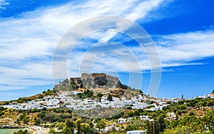 Rhodes, Greece. Lindos small whitewashed village and Acropolis, scenery of Rhodos Island at Aegean Sea