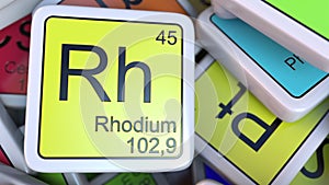 Rhodium Rh block on the pile of periodic table of the chemical elements blocks. Chemistry related 3D rendering