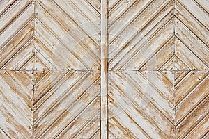 Rhomb pattern of the old weathered white painted wooden gate. photo