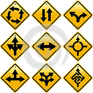 Rhombic yellow road signs with arrows directions photo