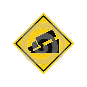 Rhomboid traffic signal in yellow and black, isolated on white background. Warning of steep descent