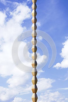 Rhomboidal axis of The Endless Column against the blue sky