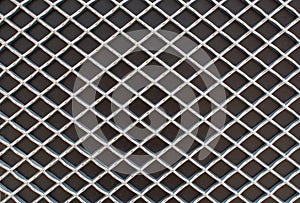 Rhombus metal pattern on black surface