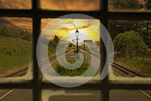 Rhyd Ddu railway station through a window at sunset. Part of the Welsh Highland Railway in the Eryri National Park