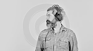 Rhythm concept. Man bearded hipster headphones listening music. Hipster enjoy excellent sound song in earphones