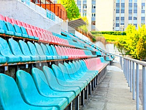 The rhythmic rows of seats of the old sports stadium
