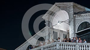 Rialto Bridge or Ponte di Rialto over Grand Canal timelapse at night in Venice, Italy.