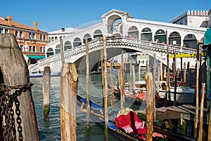View of the landmark Ponte di Rialto bridge over the Grand Canal in Venice, Italy.