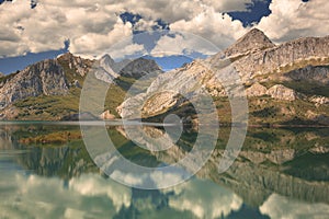 RiaÃ±o mountains mirrored on the reservoir waters