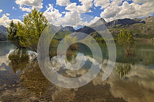 RiaÃ±o mountains mirrored on the reservoir waters