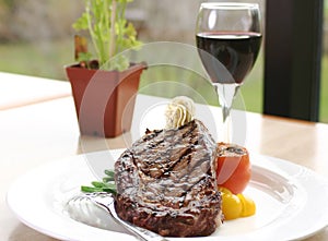 Rib Eye Steak served with wine