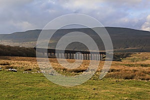 Ribblehead Viaduct under the brooding mass of Wernside, Yorkshires highest peak