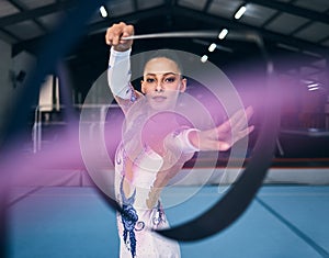 Ribbon, gymnastics and portrait of woman dance for performance, sports competition and action show. Female, rhythmic