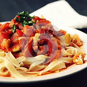 Ribbon pasta with Arrabiata sauce. Close up. Vegan